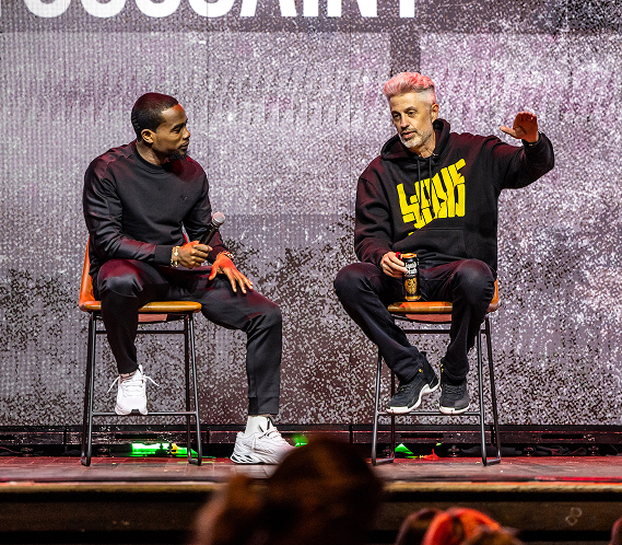 Tom See speaking on stage
